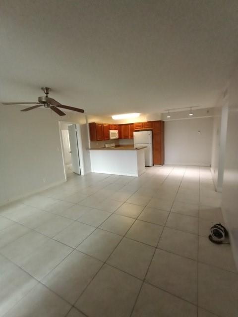 941 Lyons Road, Unit 5105 Coconut Creek, FL 33063 - Photo 2 of 22 a view of a livingroom and a garage
