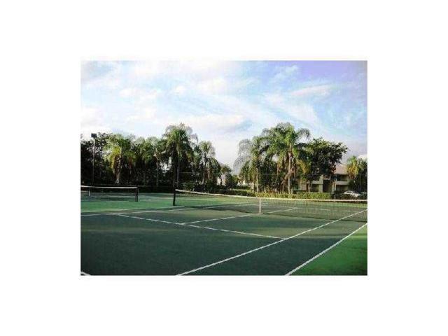 941 Lyons Road, Unit 5105 Coconut Creek, FL 33063 - Photo 22 of 22 a view of a tennis court