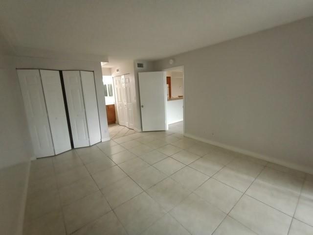 941 Lyons Road, Unit 5105 Coconut Creek, FL 33063 - Photo 7 of 22 a view of an empty room