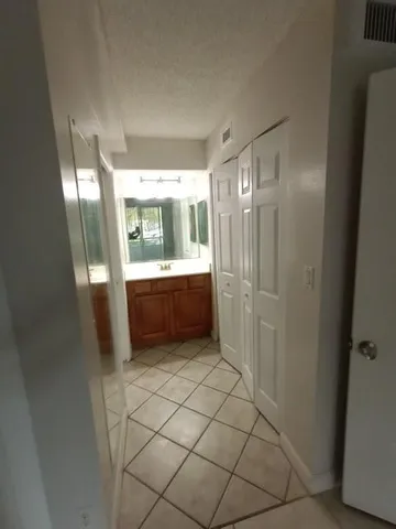 a bathroom with a mirror and a shower