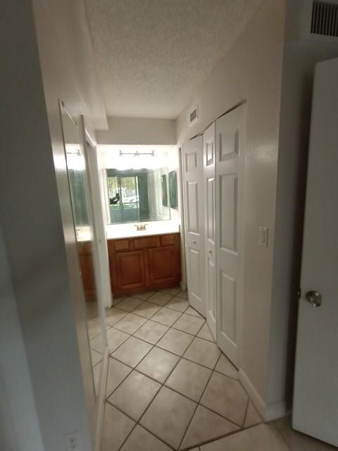 941 Lyons Road, Unit 5105 Coconut Creek, FL 33063 - Photo 8 of 22 a bathroom with a mirror and a shower