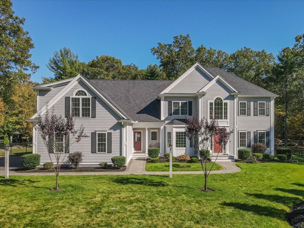 4 Lost Brook Trail Walpole, MA 02081 - Photo 1 of 42 a front view of a house with a yard