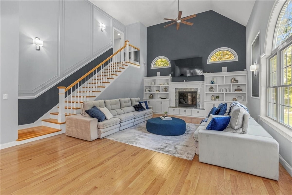 4 Lost Brook Trail Walpole, MA 02081 - Photo 13 of 42 a living room with furniture and a fireplace