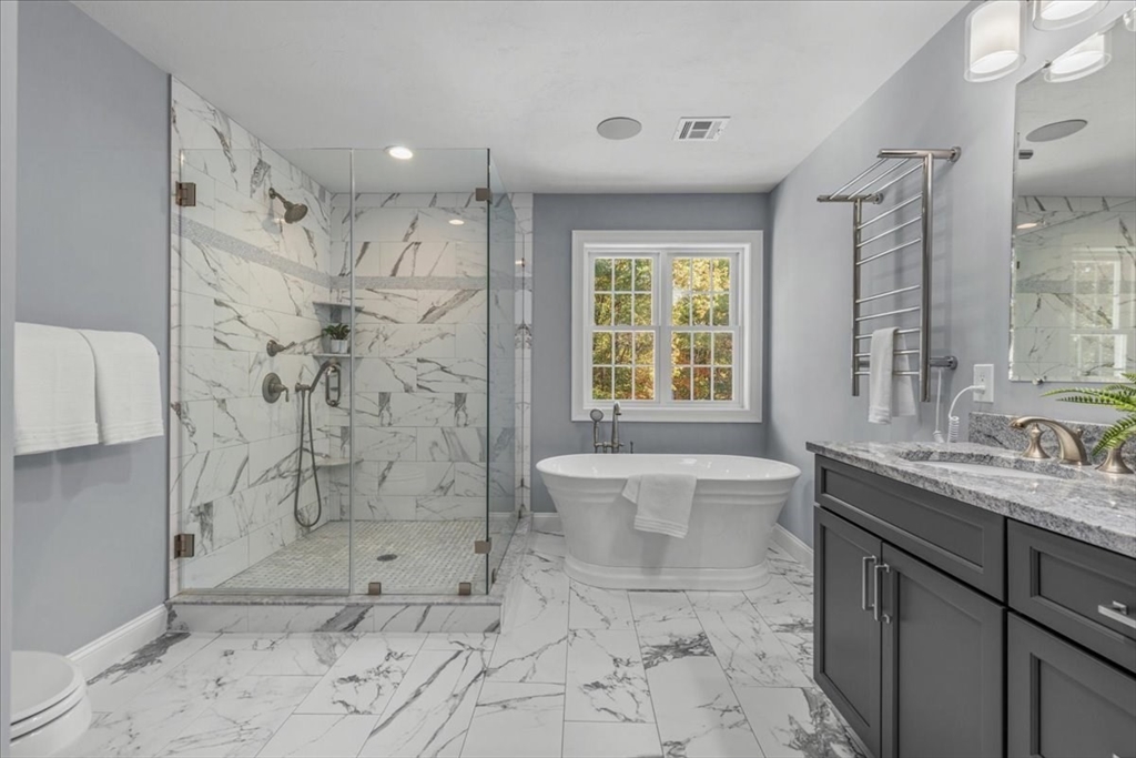 4 Lost Brook Trail Walpole, MA 02081 - Photo 21 of 42 a bathroom with a granite countertop sink mirror toilet shower and bathtub