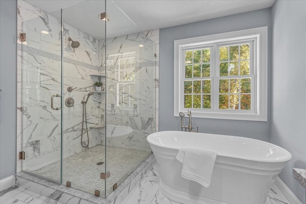 4 Lost Brook Trail Walpole, MA 02081 - Photo 22 of 42 a bathroom with a bathtub and shower