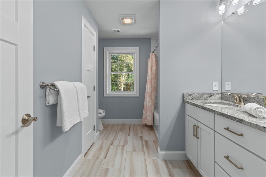 4 Lost Brook Trail Walpole, MA 02081 - Photo 24 of 42 a bathroom with a sink and mirror