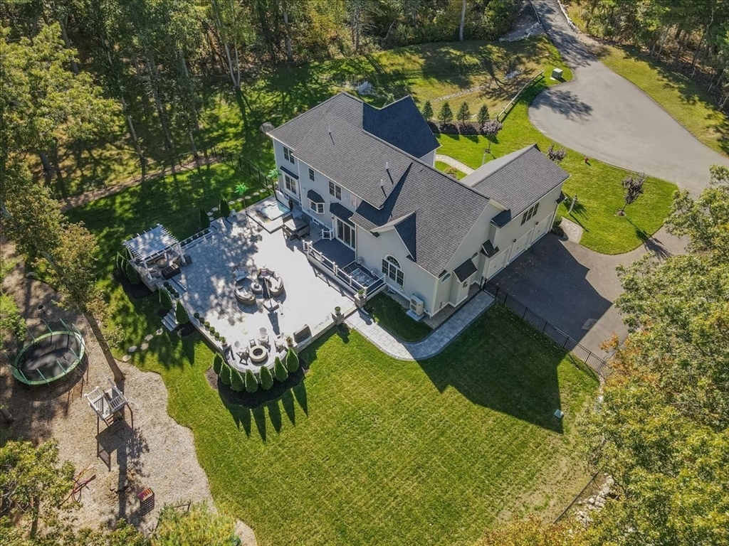 4 Lost Brook Trail Walpole, MA 02081 - Photo 3 of 42 an aerial view of a house with a garden and swimming pool