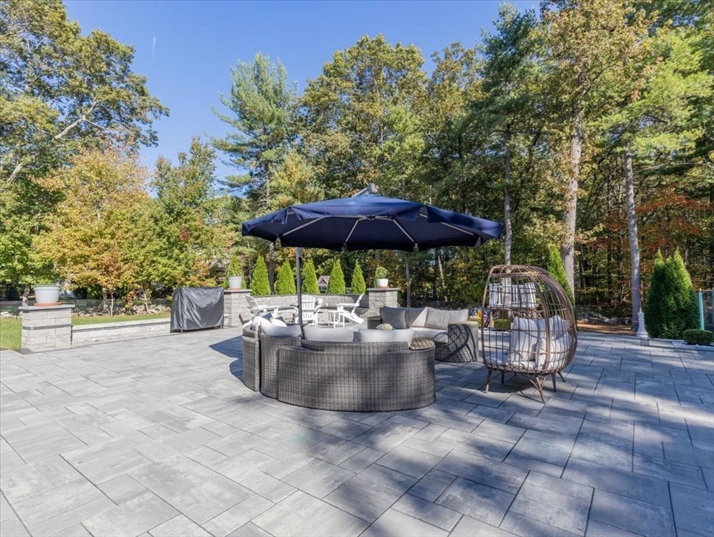 4 Lost Brook Trail Walpole, MA 02081 - Photo 36 of 42 a view of backyard with outdoor seating and trees