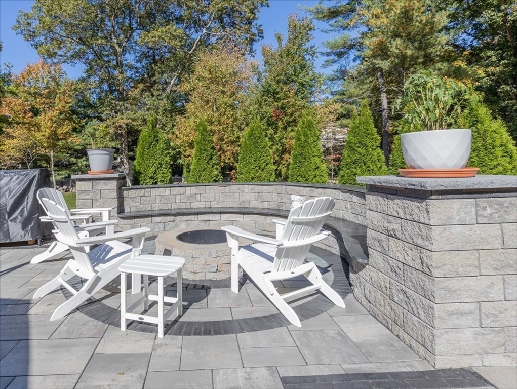 4 Lost Brook Trail Walpole, MA 02081 - Photo 38 of 42 a view of a patio with table and chairs and potted plants