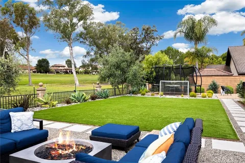 a view of a wooden deck and a garden