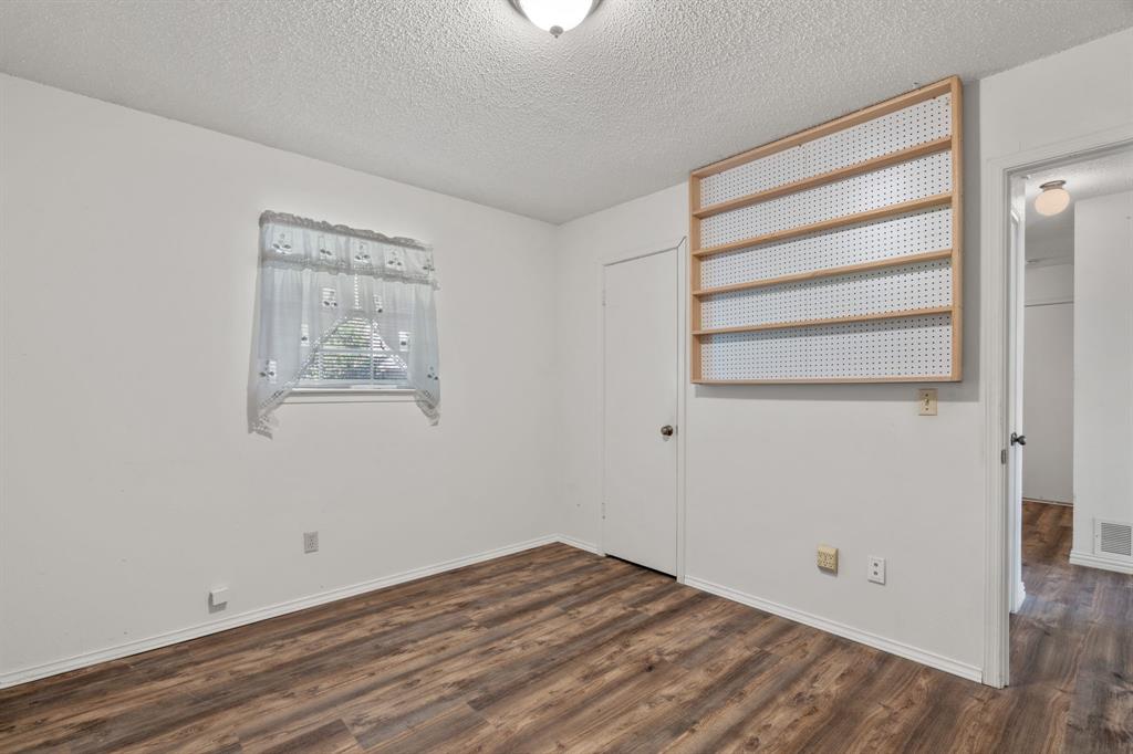337 Town N Drive Terrell, TX 75160 - Photo 16 of 30 a view of empty room with wooden floor