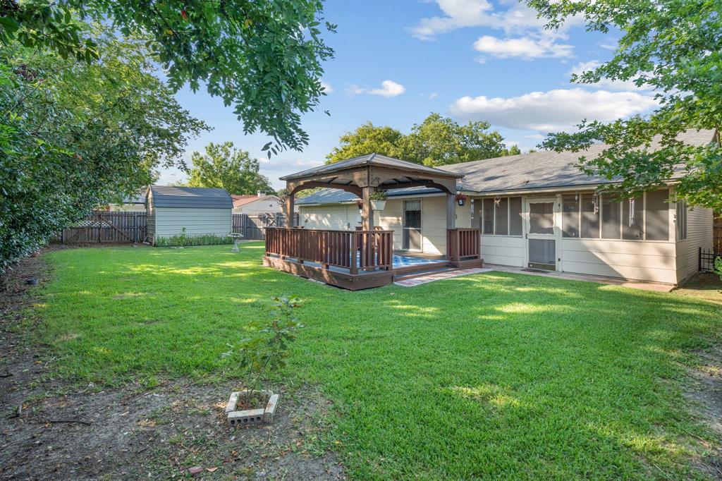 337 Town N Drive Terrell, TX 75160 - Photo 24 of 30 a view of a house with a backyard and a patio