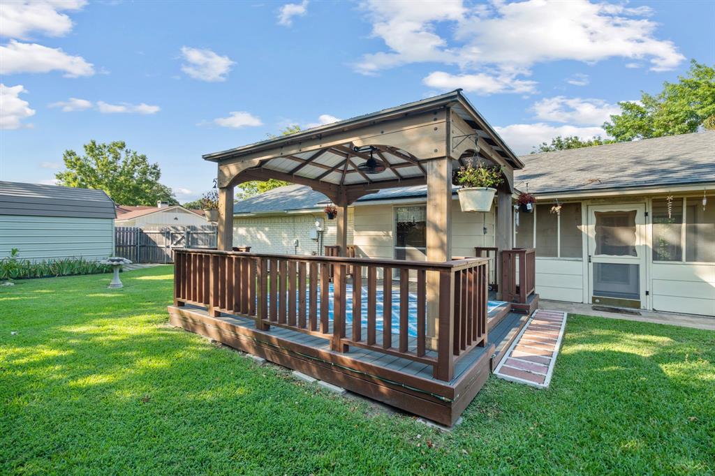 337 Town N Drive Terrell, TX 75160 - Photo 25 of 30 a view of a house with a yard and deck
