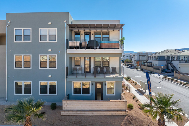 762 West Periwinkle Lane, Unit 102 St. George, UT 84790 - Photo 27 of 40 Back of property featuring stucco siding, a balcony, and a residential view