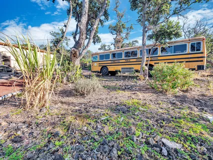 a view of a dining room with furniture large windows and wooden floor