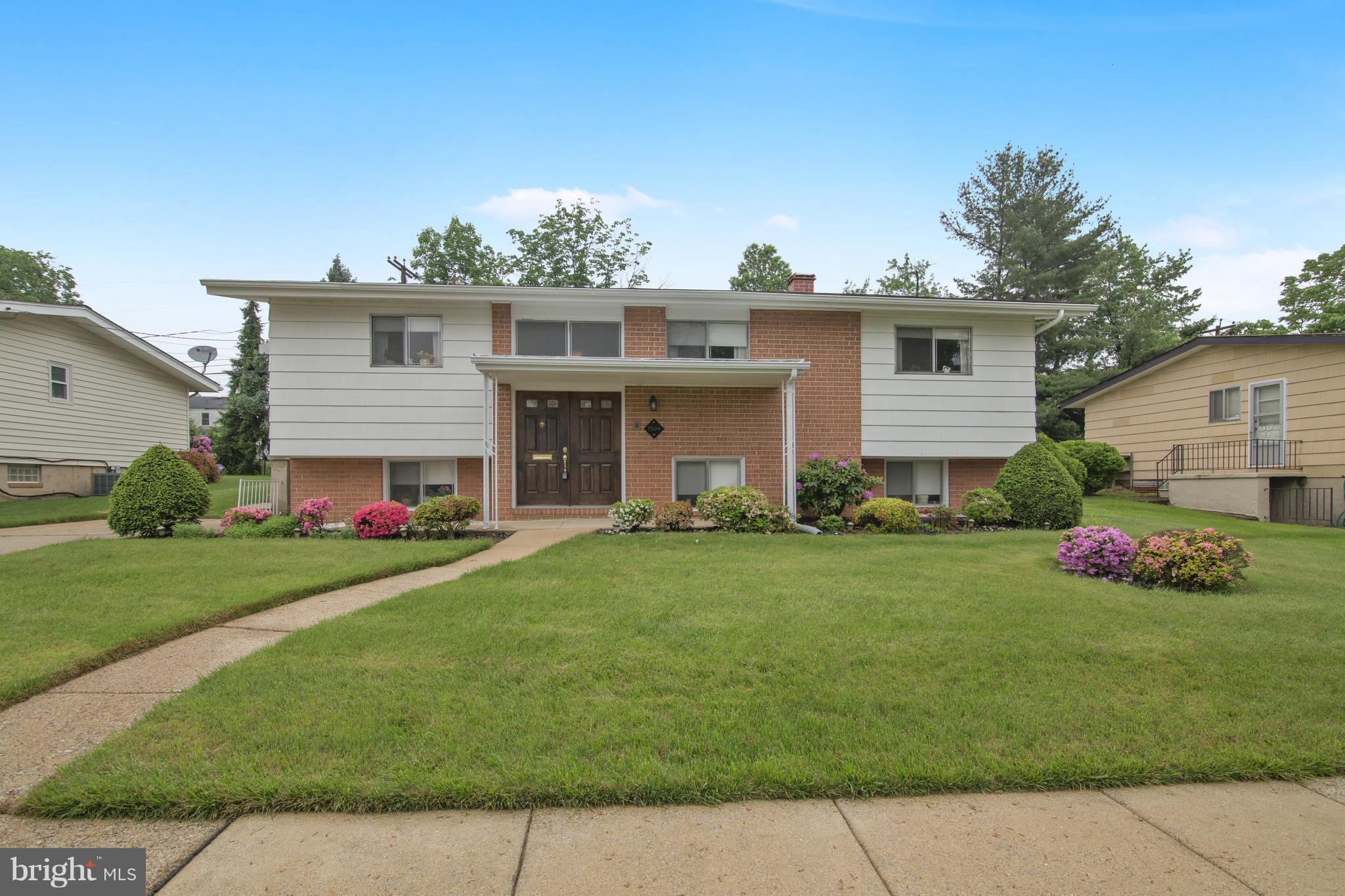 7504 Shelowood Road Baltimore, MD 21208 - Photo 1 of 29 a front view of house with yard and green space