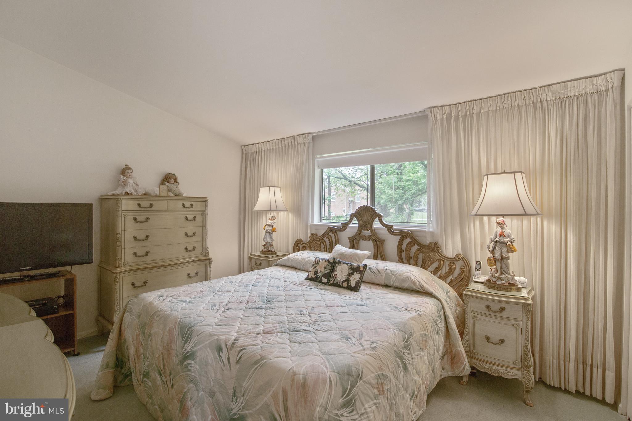 7504 Shelowood Road Baltimore, MD 21208 - Photo 13 of 29 a bedroom with a bed and a window