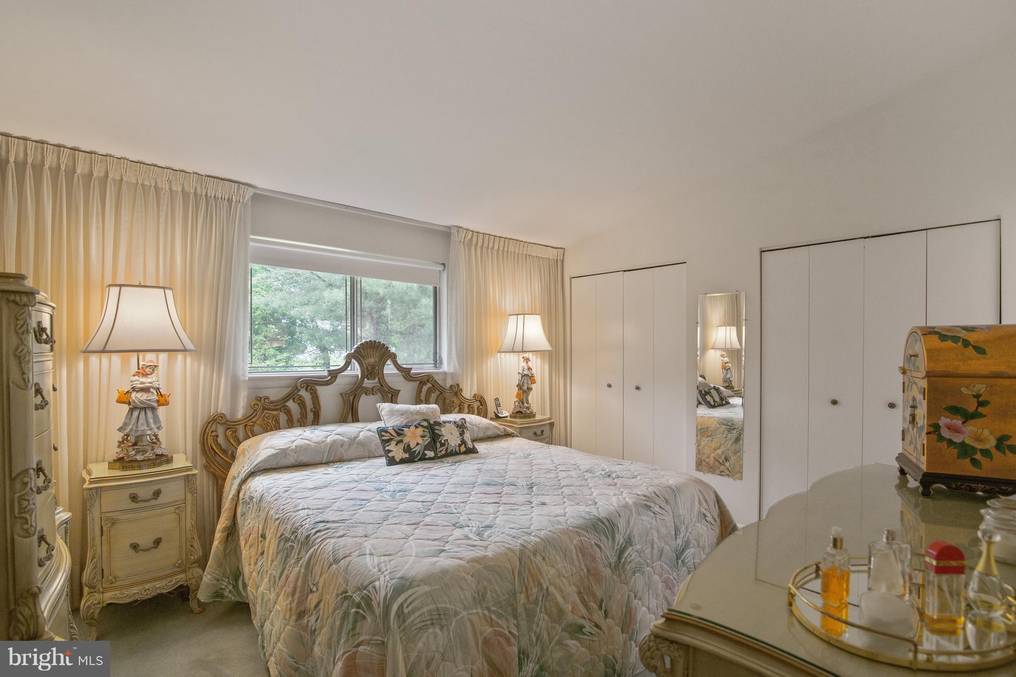 7504 Shelowood Road Baltimore, MD 21208 - Photo 15 of 29 a large bedroom with a bed and large windows