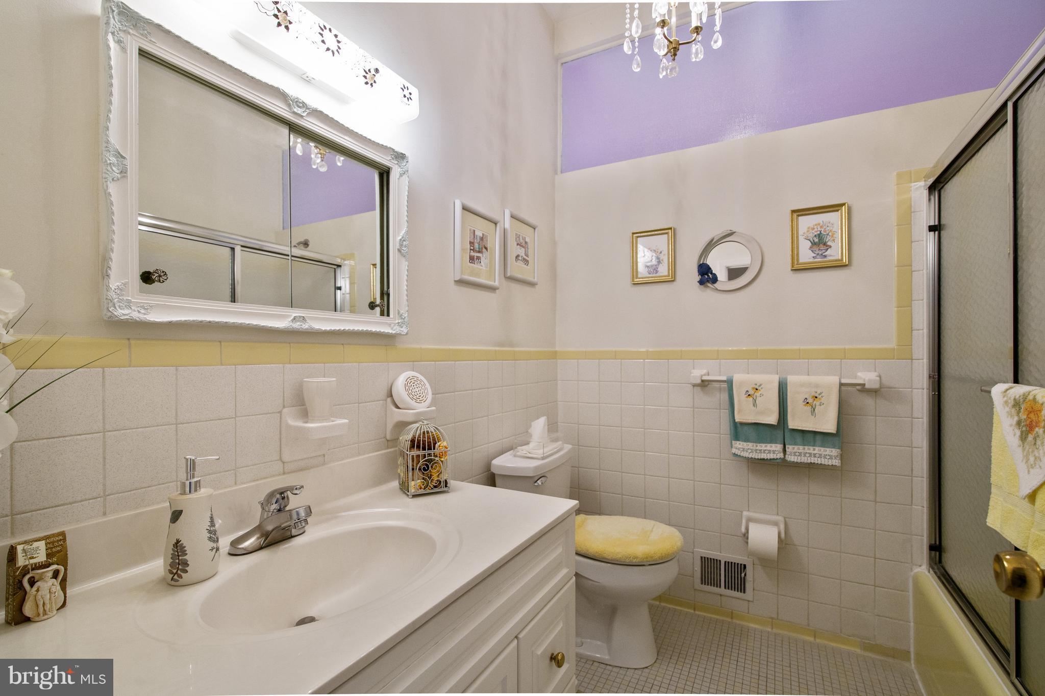 7504 Shelowood Road Baltimore, MD 21208 - Photo 16 of 29 a bathroom with a toilet sink and mirror