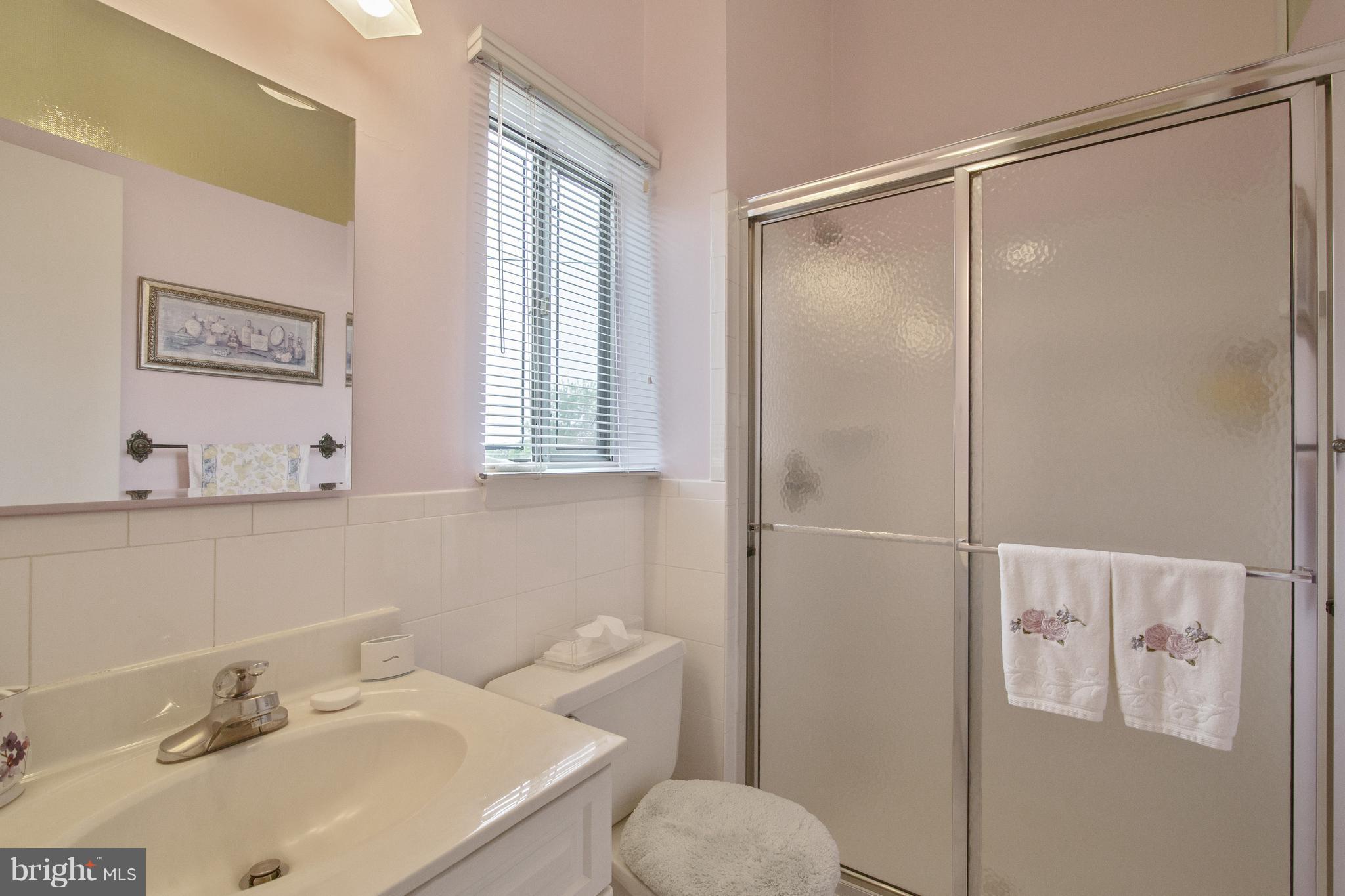7504 Shelowood Road Baltimore, MD 21208 - Photo 18 of 29 a bathroom with a sink toilet and shower