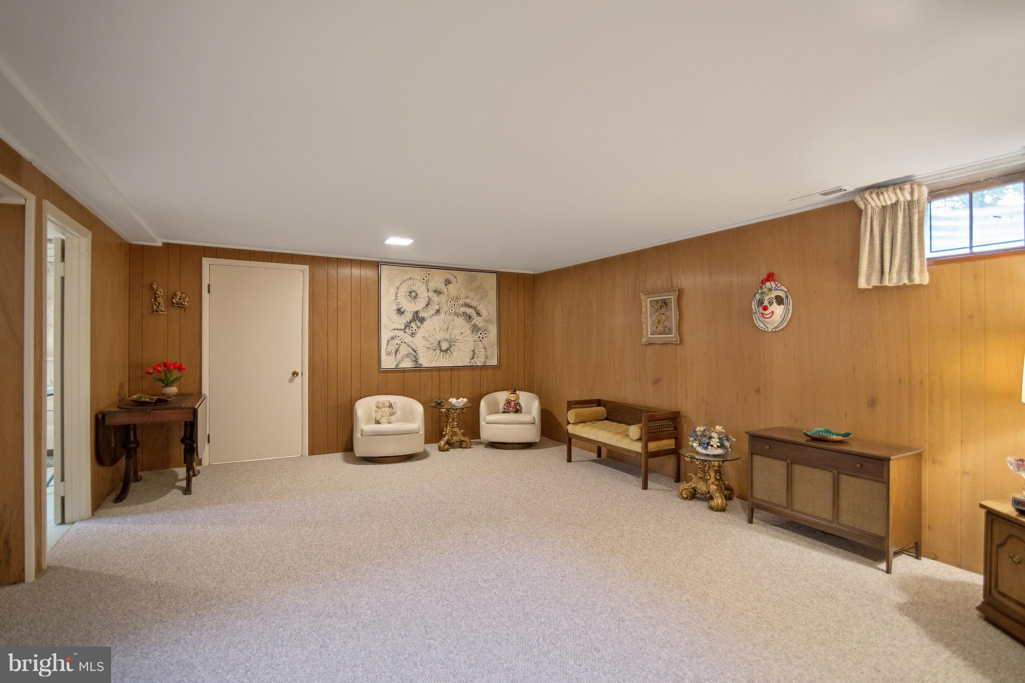 7504 Shelowood Road Baltimore, MD 21208 - Photo 20 of 29 a bedroom with furniture and a window