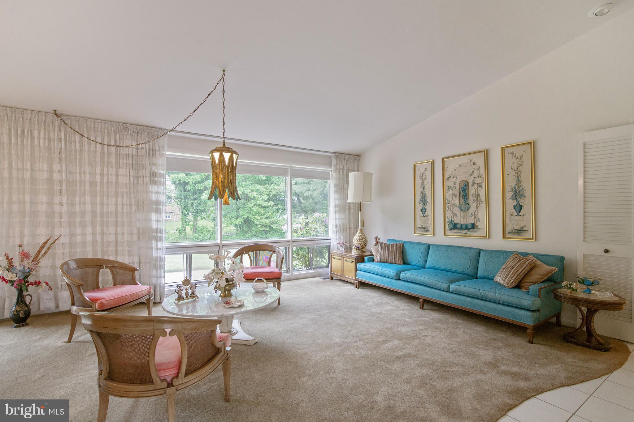 7504 Shelowood Road Baltimore, MD 21208 - Photo 5 of 29 a living room with furniture and a large window