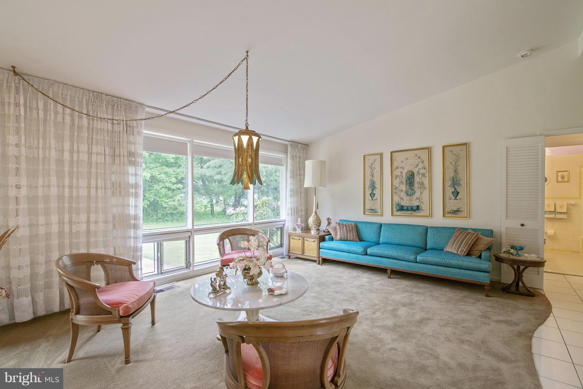7504 Shelowood Road Baltimore, MD 21208 - Photo 6 of 29 a living room with furniture and a large window