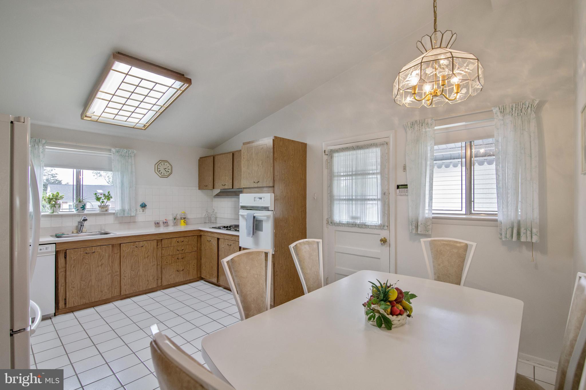 7504 Shelowood Road Baltimore, MD 21208 - Photo 9 of 29 a view of kitchen with dining table and chairs