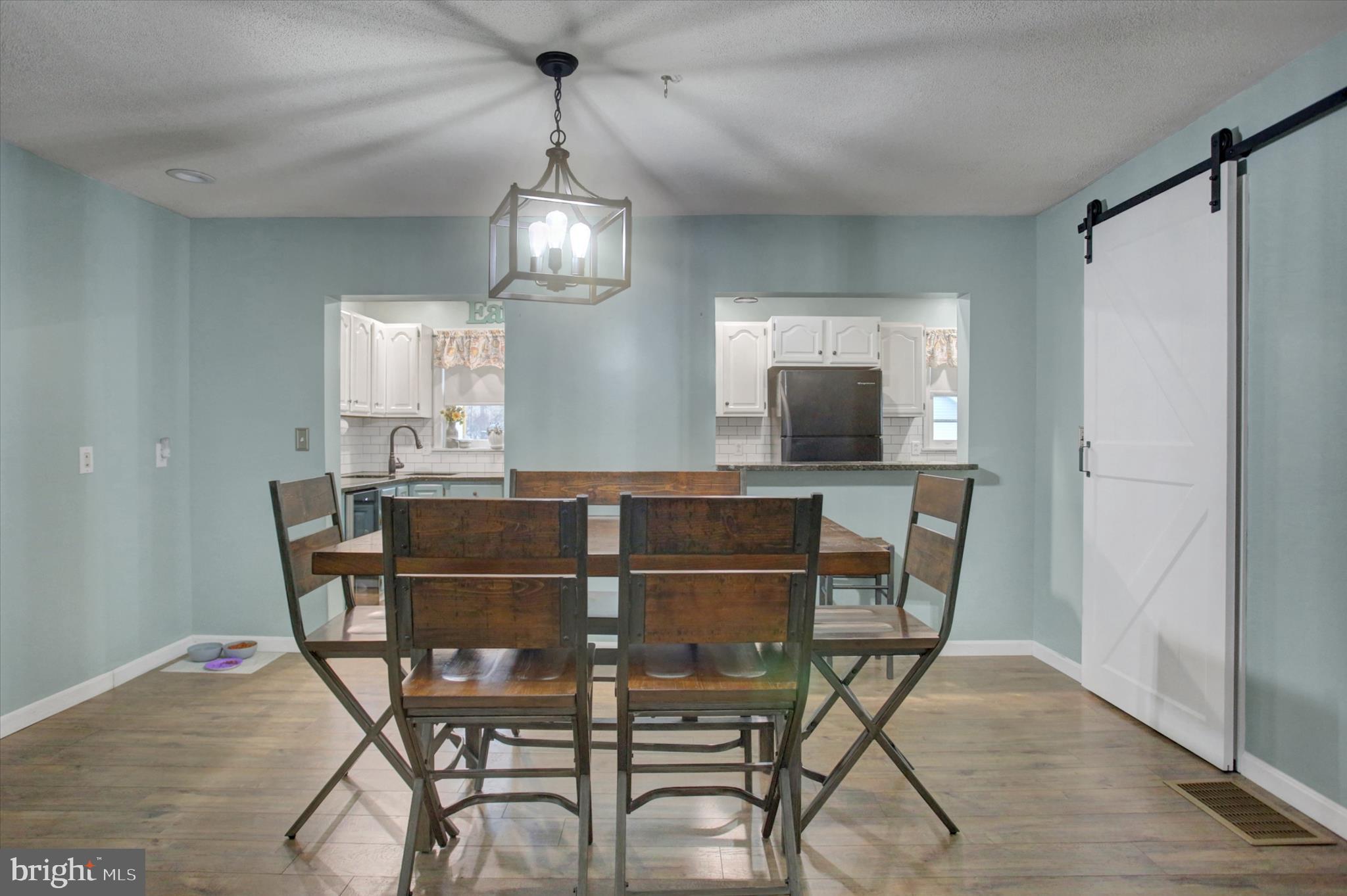 615 Walnut Bottom Road Shippensburg, PA 17257 - Photo 13 of 47 a view of a dining room with furniture and a chandelier