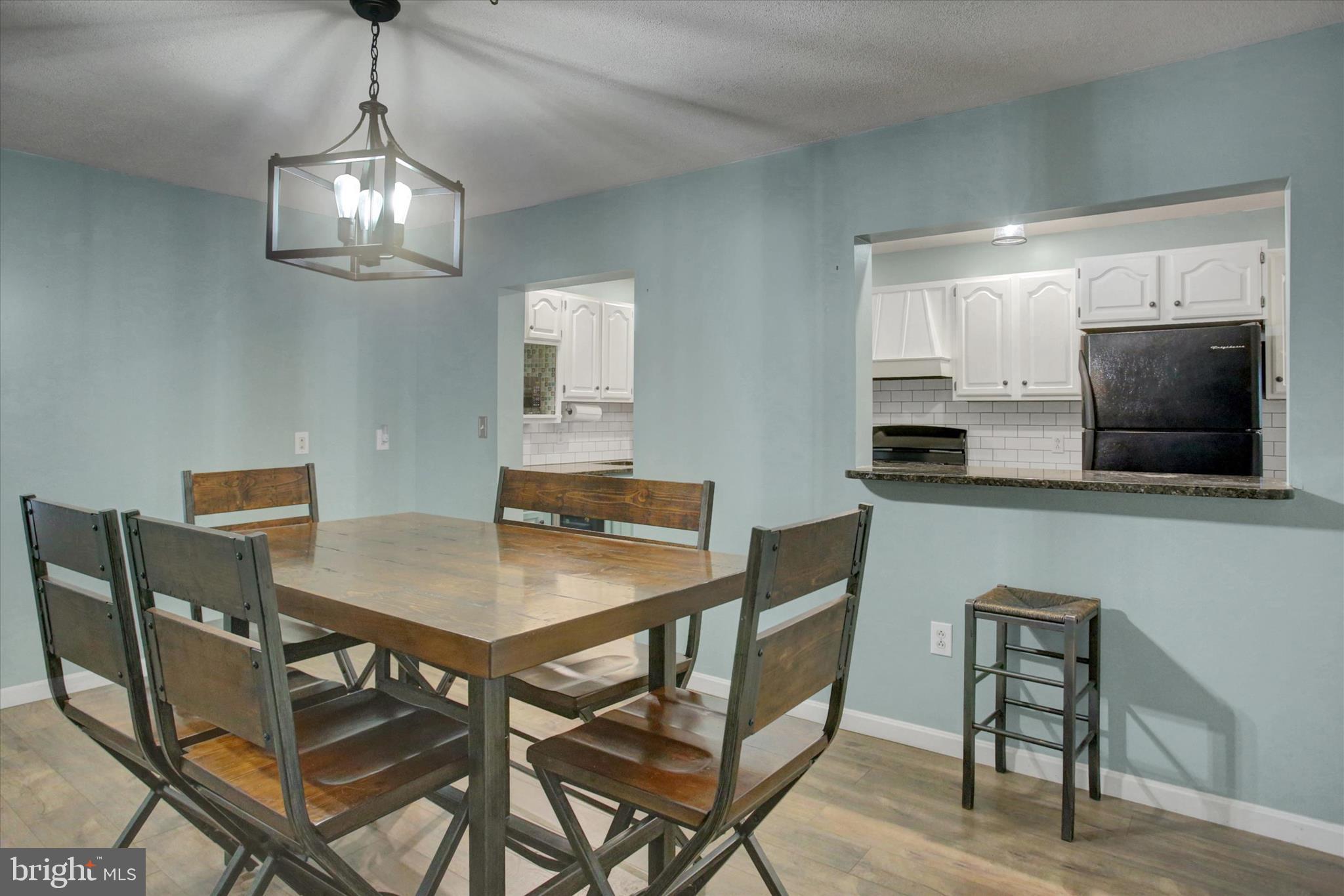 615 Walnut Bottom Road Shippensburg, PA 17257 - Photo 14 of 47 a view of a dining room with furniture and wooden floor