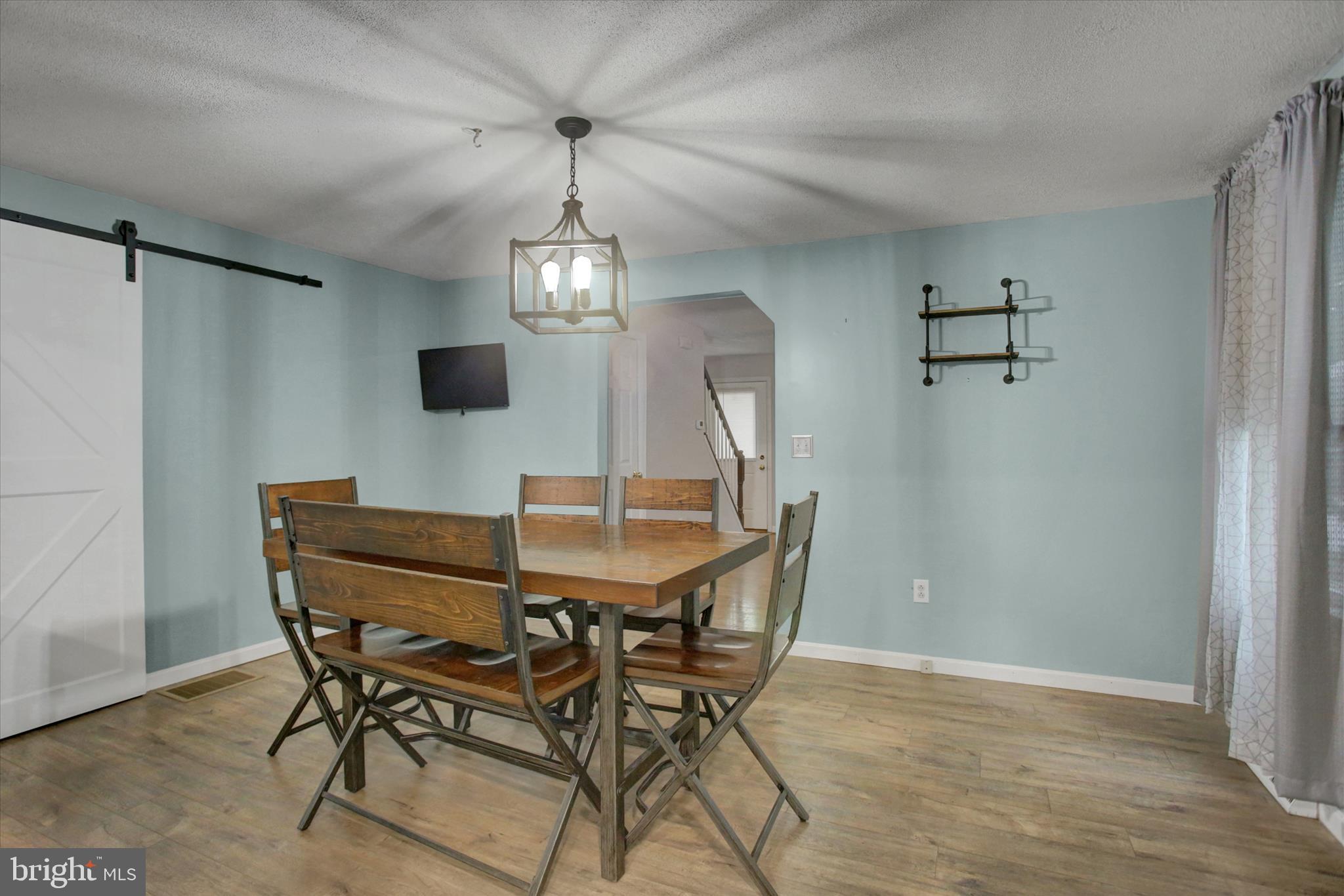 615 Walnut Bottom Road Shippensburg, PA 17257 - Photo 15 of 47 a view of a dining room with furniture and chandelier