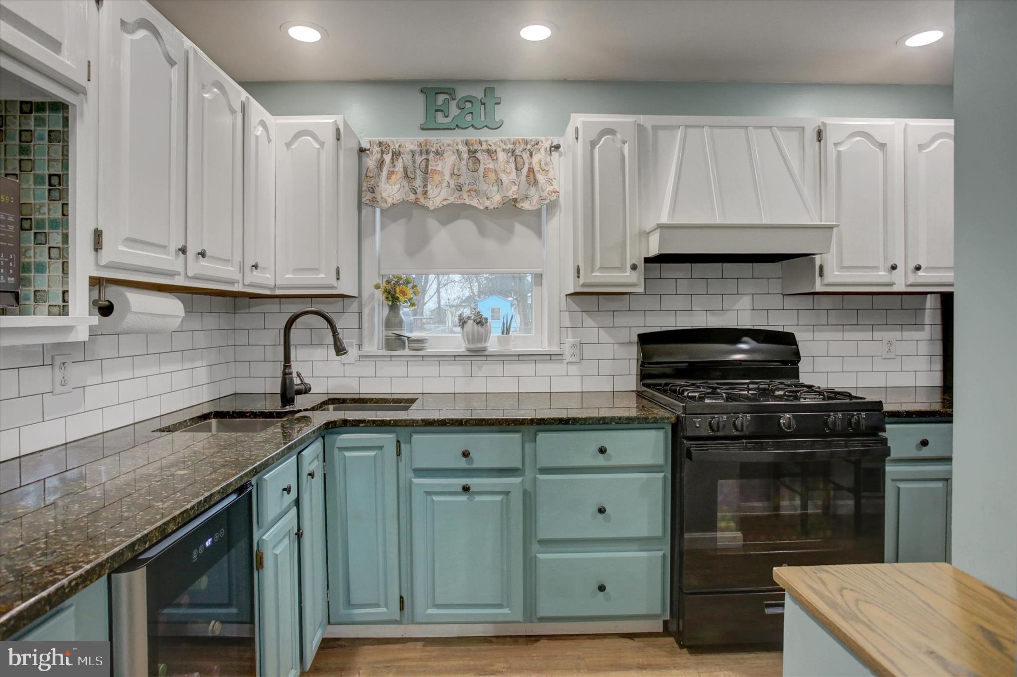 615 Walnut Bottom Road Shippensburg, PA 17257 - Photo 16 of 47 a kitchen with granite countertop a stove sink and cabinets