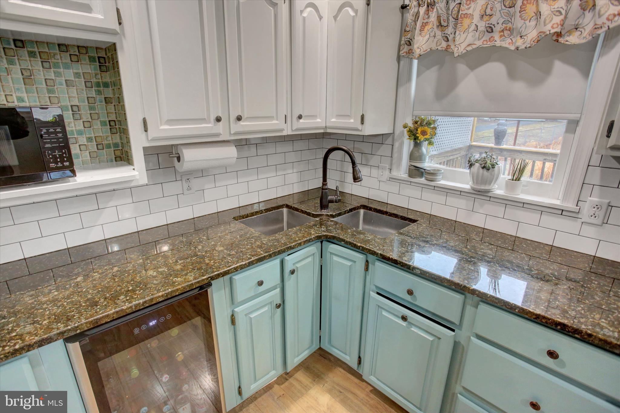 615 Walnut Bottom Road Shippensburg, PA 17257 - Photo 18 of 47 a kitchen with granite countertop a sink stainless steel appliances and cabinets