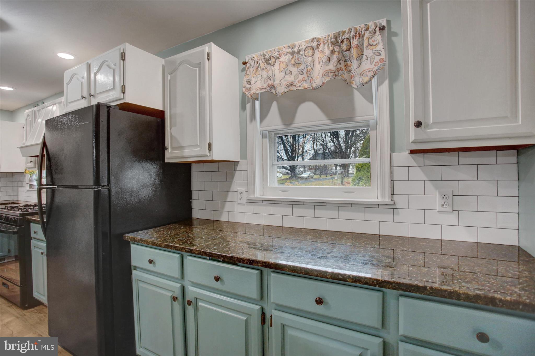 615 Walnut Bottom Road Shippensburg, PA 17257 - Photo 21 of 47 a kitchen with granite countertop a refrigerator and a sink