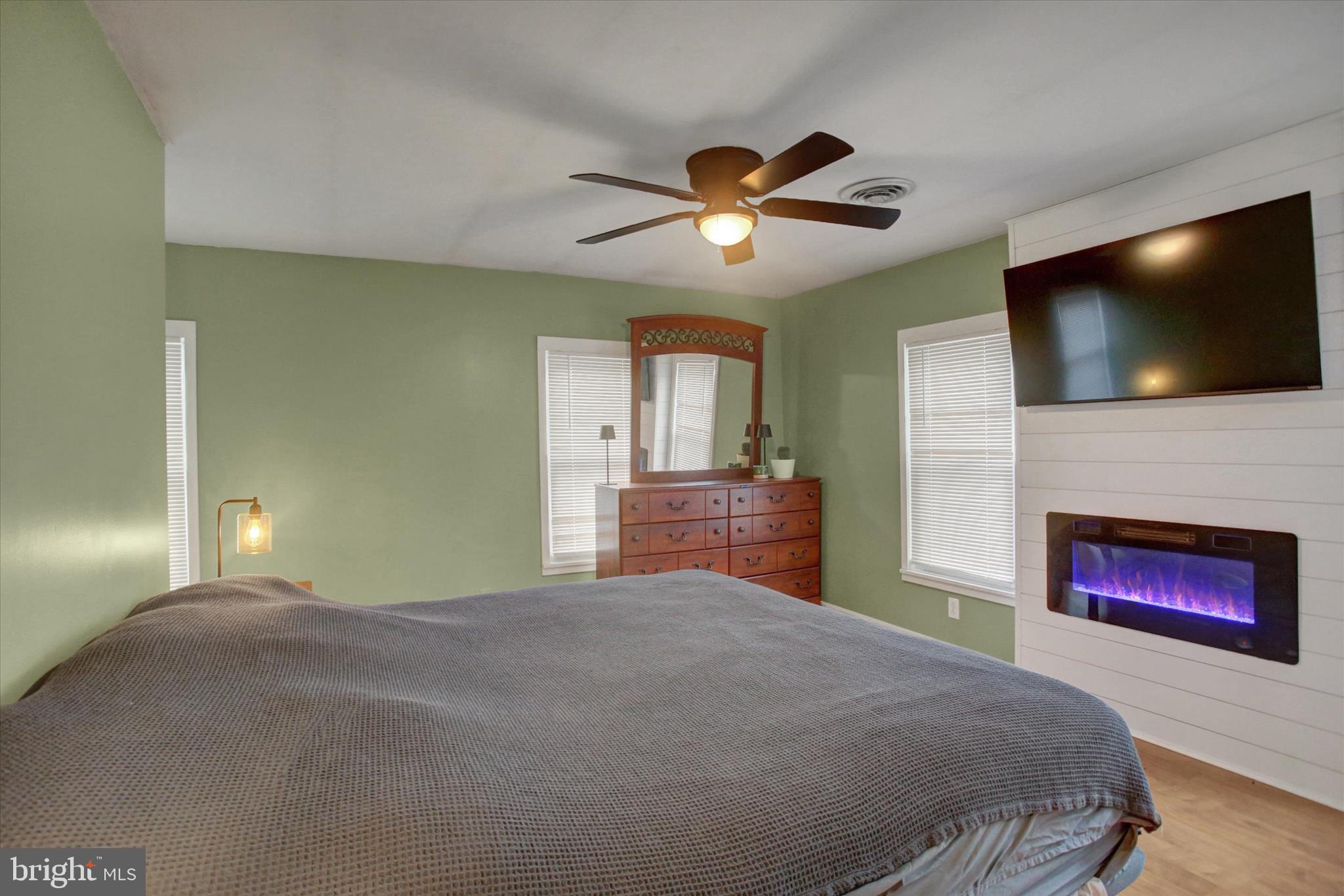 615 Walnut Bottom Road Shippensburg, PA 17257 - Photo 26 of 47 a bedroom with a bed and a flat screen tv