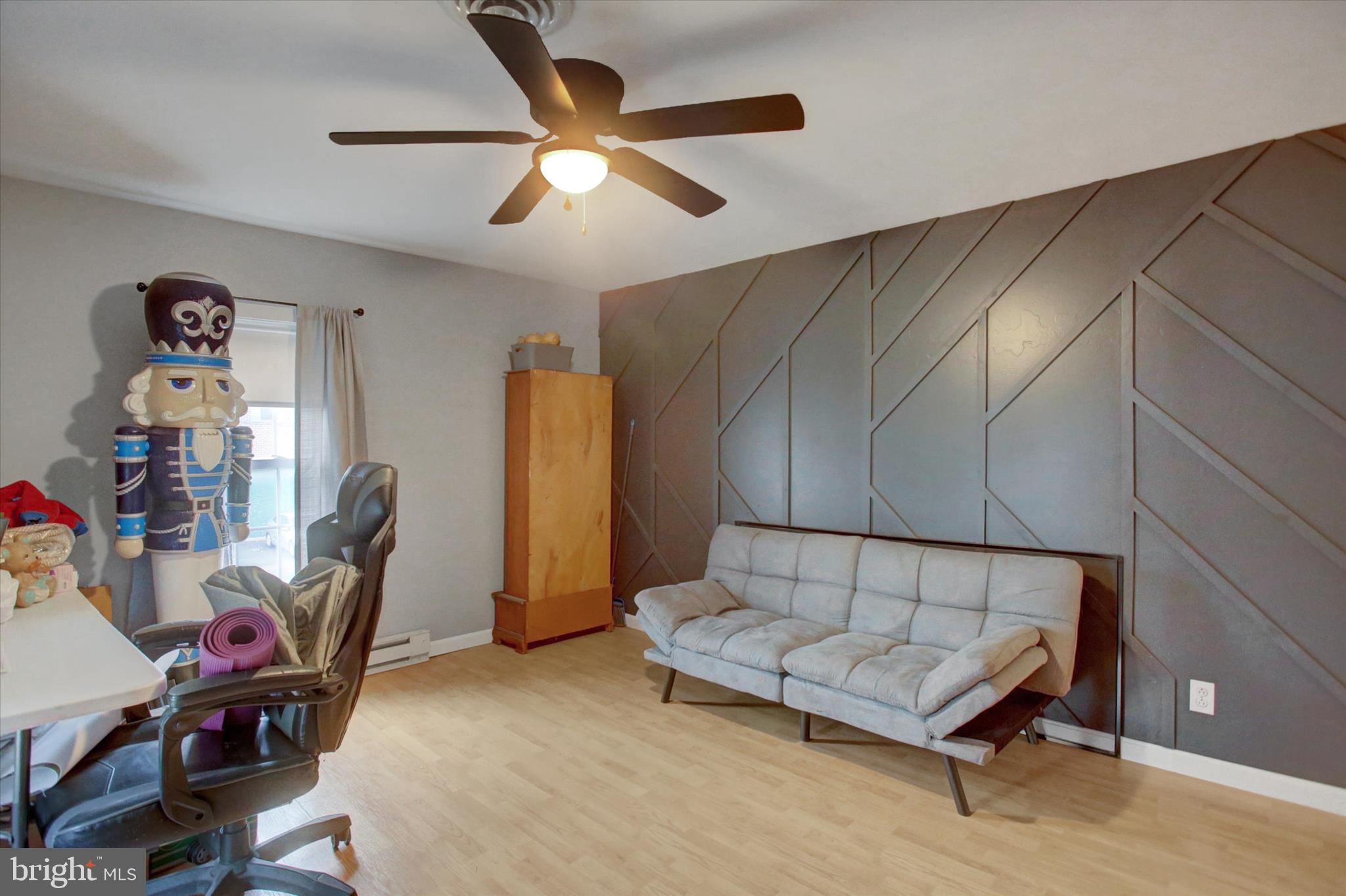615 Walnut Bottom Road Shippensburg, PA 17257 - Photo 30 of 47 a living room with furniture a ceiling fan and a rug