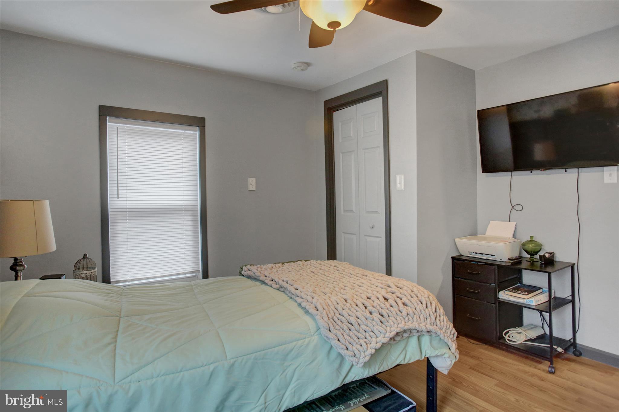 615 Walnut Bottom Road Shippensburg, PA 17257 - Photo 32 of 47 a bedroom with a bed and a flat screen tv