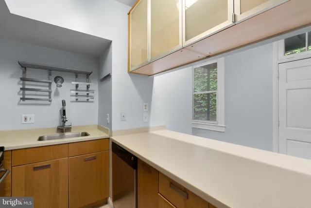 a utility room with a sink dryer and washer
