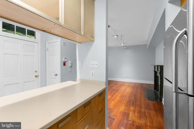 a view of hallway with wooden floor