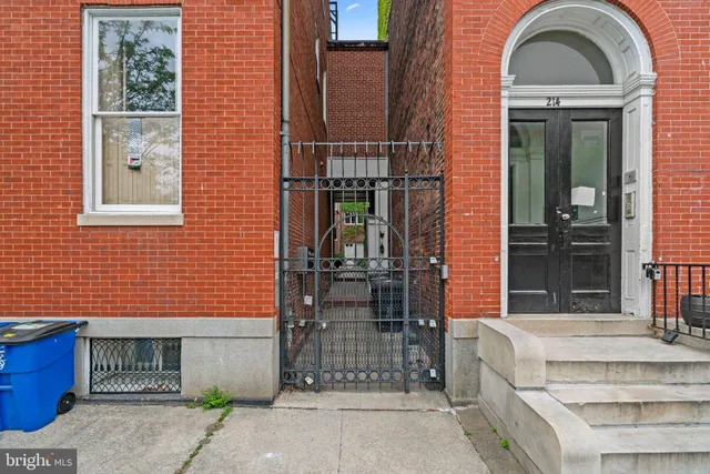 a front view of a house with large windows