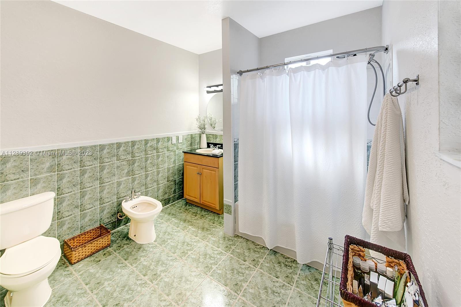 100 Southwest 26th Road Miami, FL 33129 - Photo 17 of 34 a bathroom with a toilet sink and shower