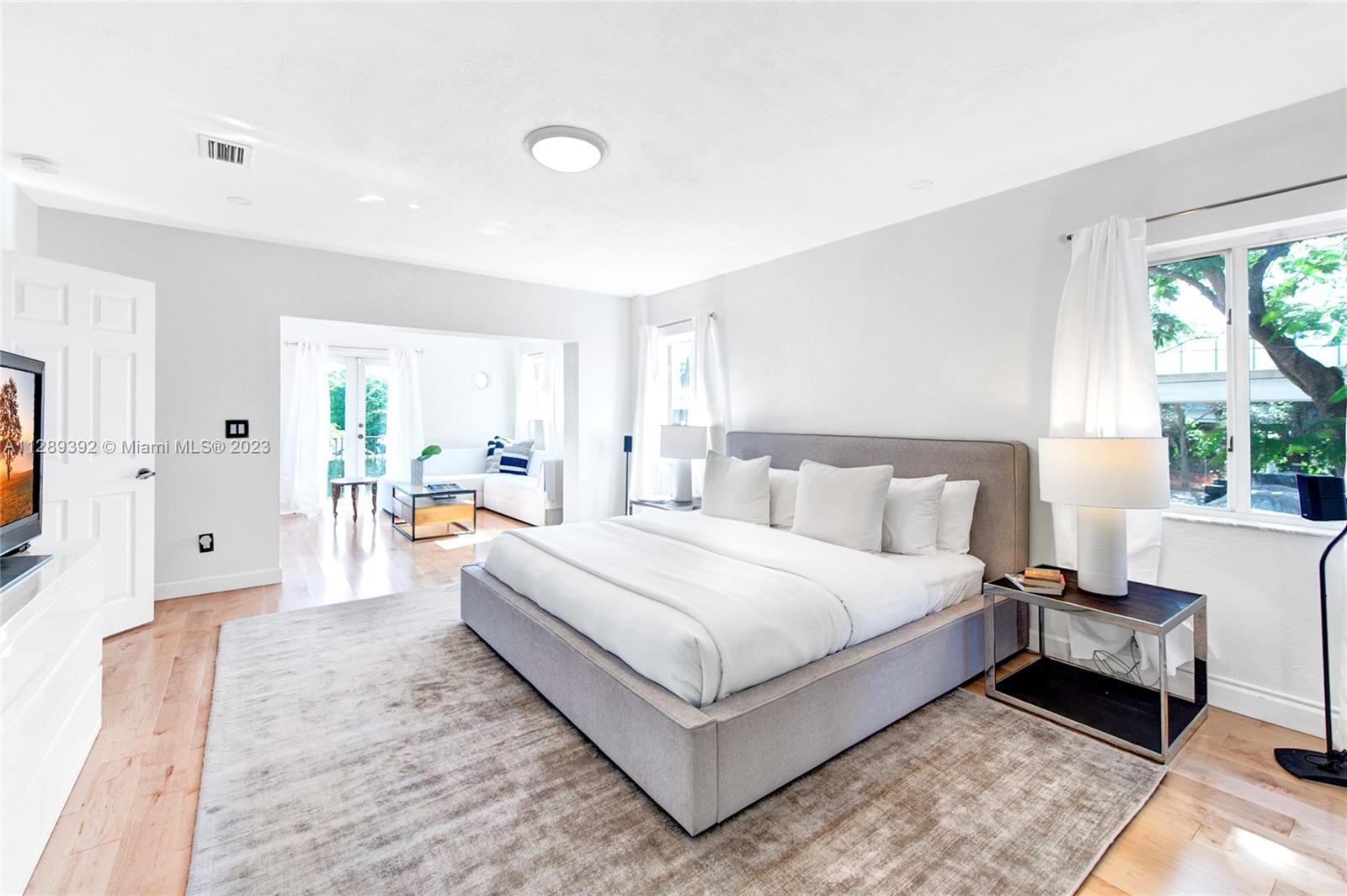 100 Southwest 26th Road Miami, FL 33129 - Photo 21 of 34 a bedroom with a bed couch and a window