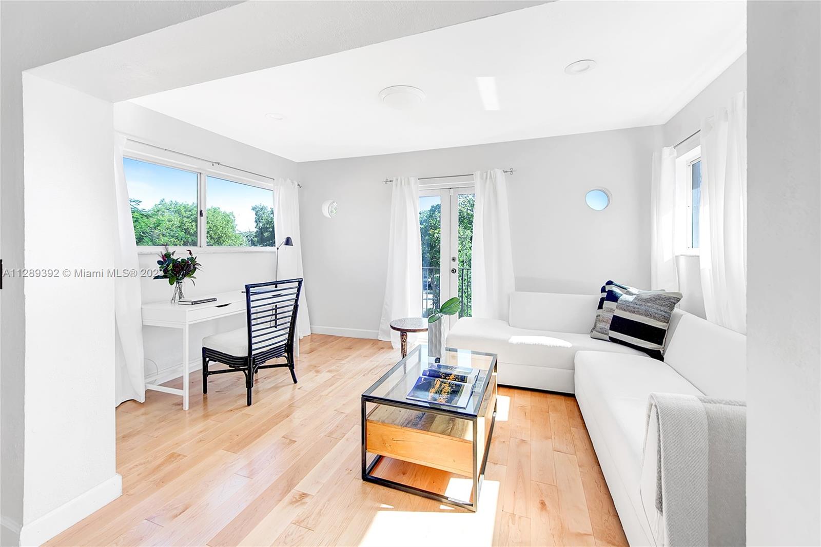100 Southwest 26th Road Miami, FL 33129 - Photo 22 of 34 a living room with furniture and a wooden floor