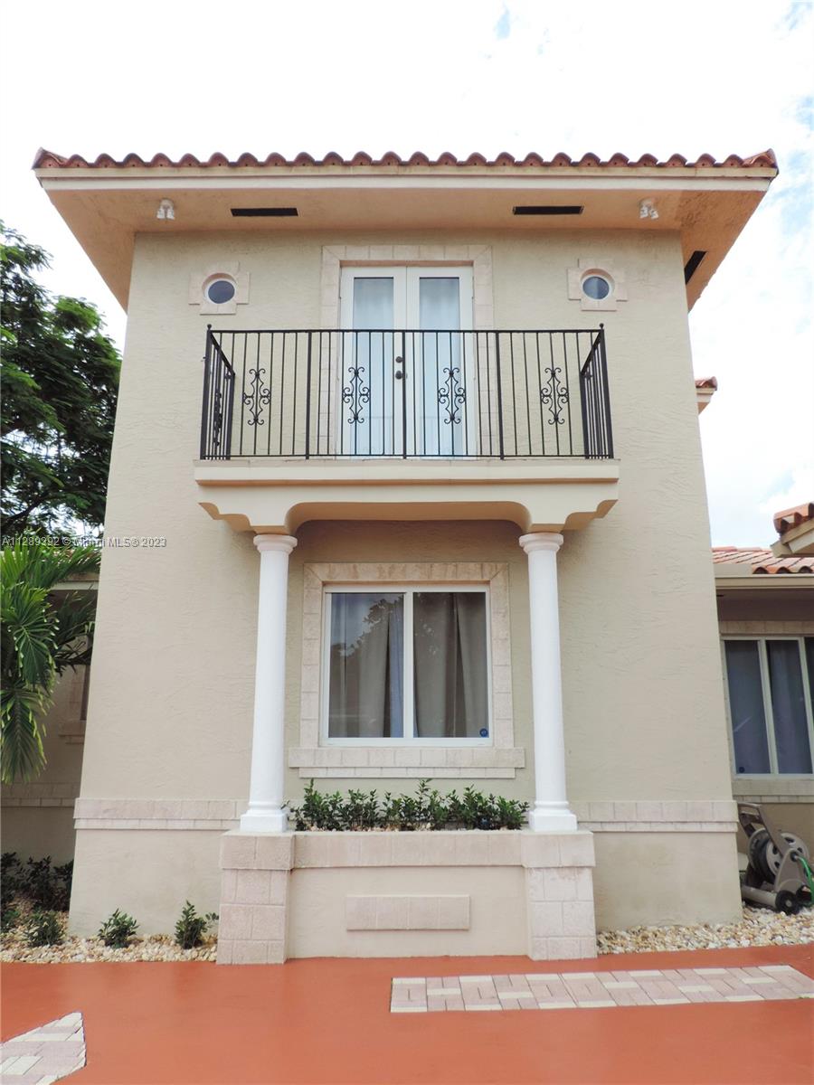 100 Southwest 26th Road Miami, FL 33129 - Photo 31 of 34 a front view of a house with porch