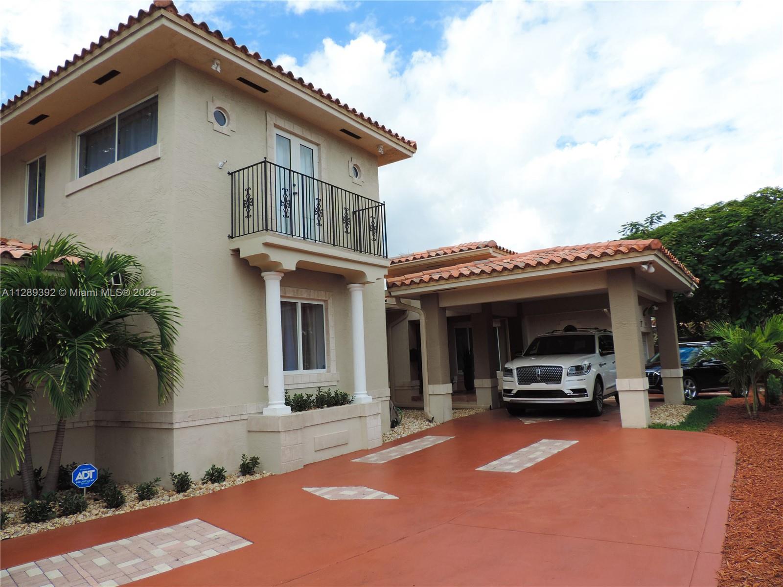 100 Southwest 26th Road Miami, FL 33129 - Photo 33 of 34 a front view of a house with cars parked
