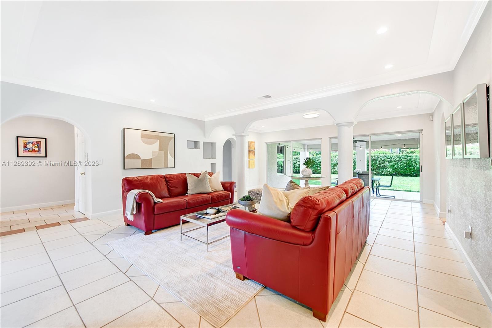 100 Southwest 26th Road Miami, FL 33129 - Photo 6 of 34 a living room with furniture and a floor to ceiling window