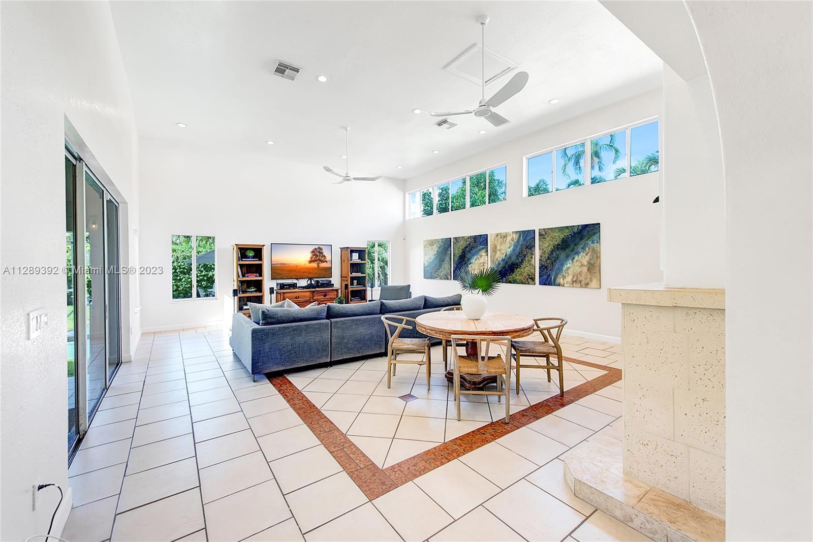 100 Southwest 26th Road Miami, FL 33129 - Photo 10 of 34 a living room with furniture and a flat screen tv