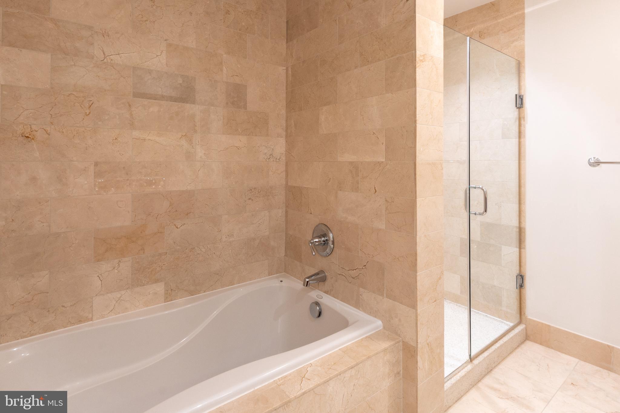 2425 L Street Northwest, Unit 431 Washington, DC 20037 - Photo 19 of 30 a bathroom with a bathtub