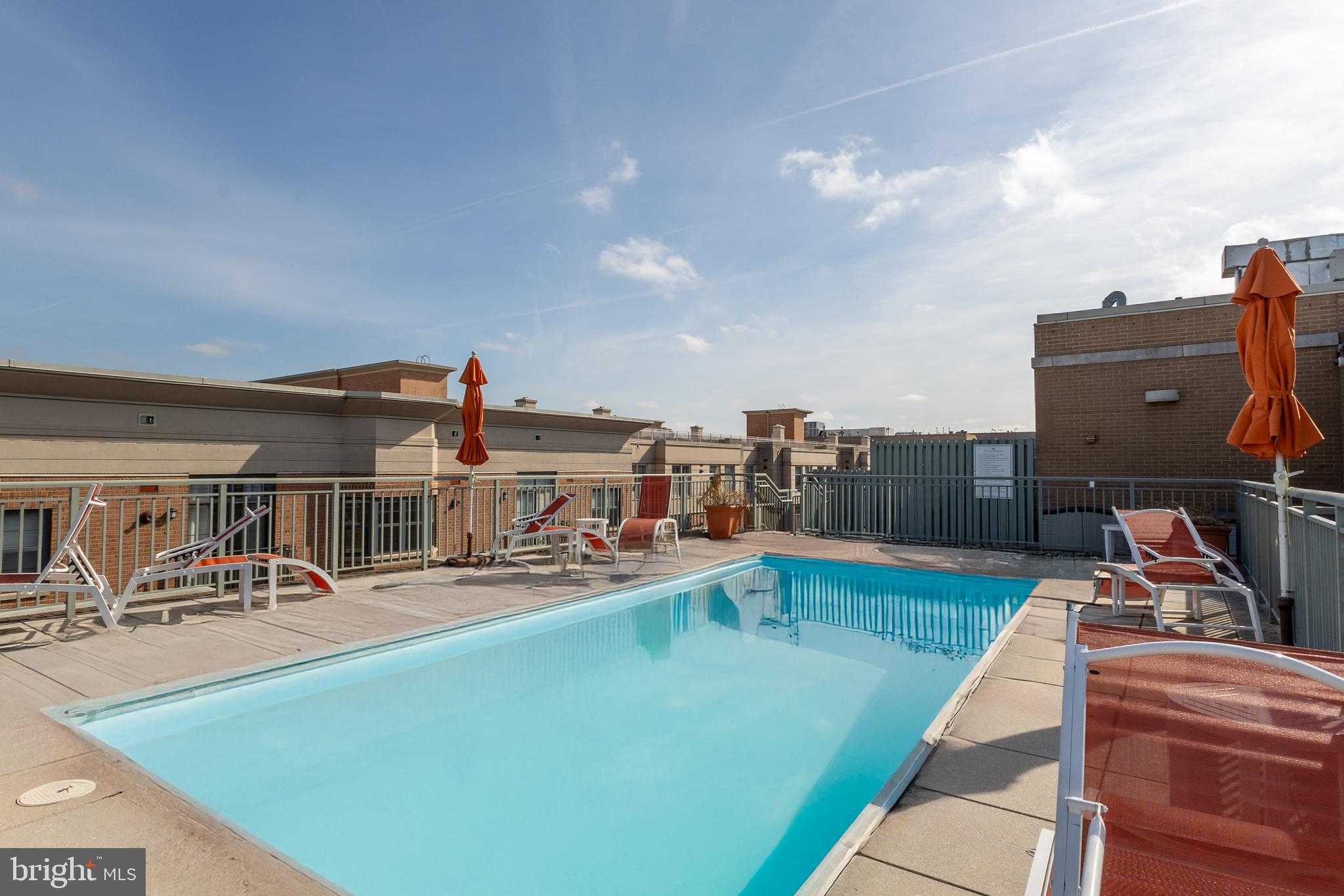 2425 L Street Northwest, Unit 431 Washington, DC 20037 - Photo 27 of 30 a view of a swimming pool with outdoor seating