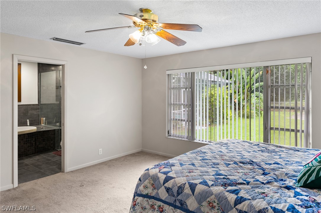 2340 Old N River Road LaBelle, FL 33935 - Photo 12 of 28 a bedroom with a bed and a window